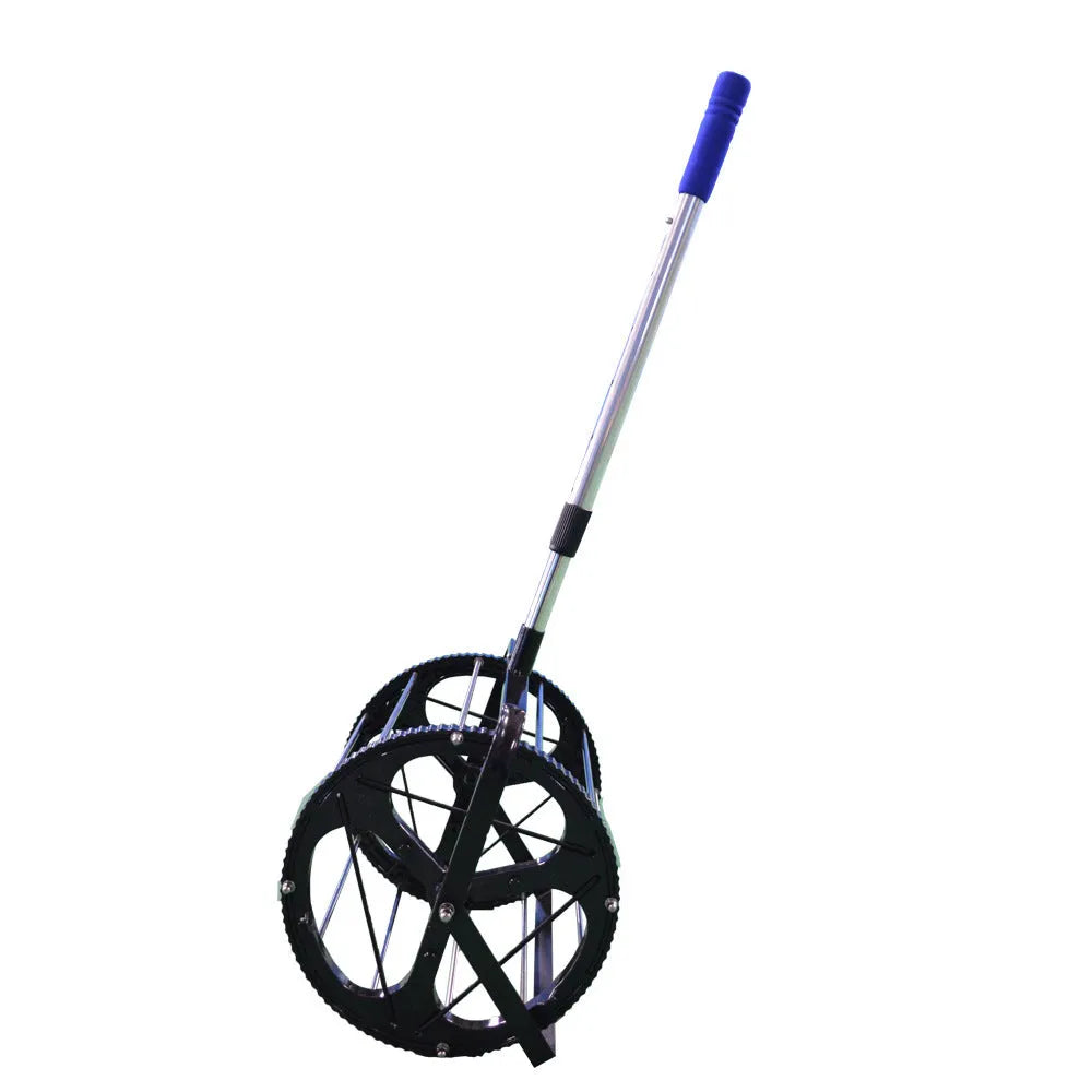 Black tennis ball picker basket made of nylon and metal on a court surface