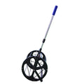 Black tennis ball picker basket made of nylon and metal on a court surface