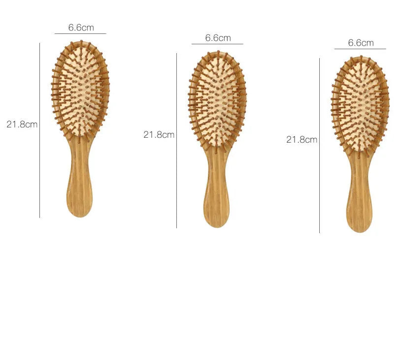 Carbonised bamboo massage comb 66x218mm on neutral background with smooth wooden surface visible