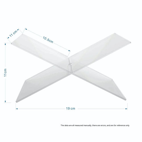 Clear acrylic X-shaped book display stand holding a hardback book on a wooden desk.