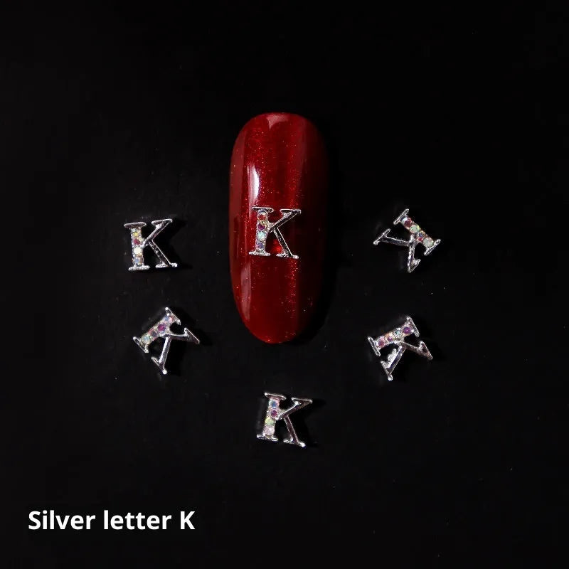 Gold alloy letter A nail ornament charm with crystal detail on a square chain base
