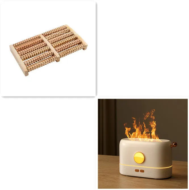 Black USB desktop humidifier with decorative orange flame effect and water tank on a wooden desk.