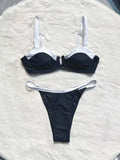 Women's black low waist bikini swimsuit with stitching detail and split leg design