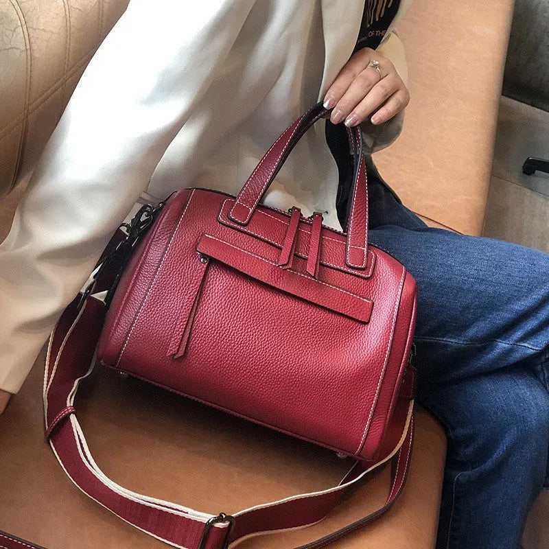 Genuine leather messenger bag with Boston lychee pattern stitching showing horizontal square shape and shoulder strap