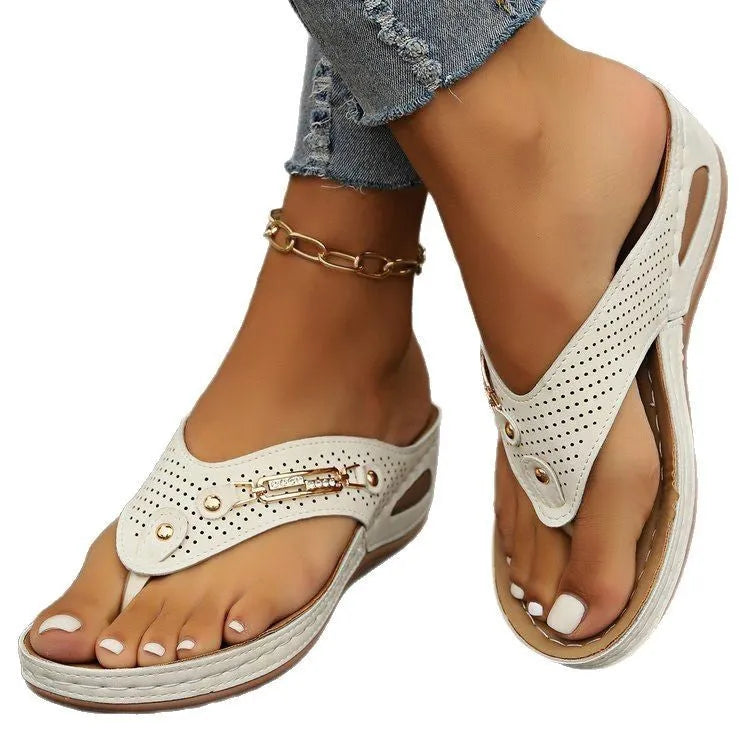 Women's retro flip-flop sandals in light brown colour showing PU upper material and herringbone scaffold design