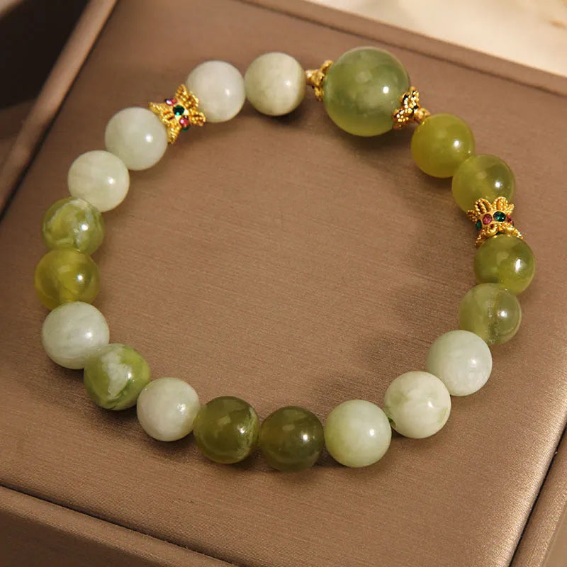 Women's green Xiuyan jade bracelet with an original sweet Mori style design.