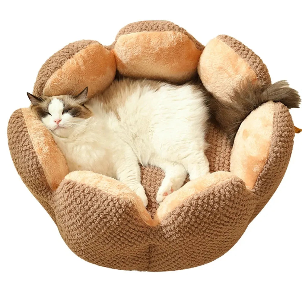 Green cactus petal shaped enclosed soft plush bed for a cat or small dog on a hardwood floor.