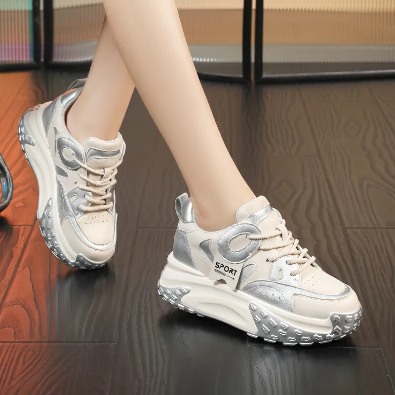 A pair of thick-soled leather casual shoes with a wedge heel and front lace-up design.