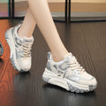 A pair of thick-soled leather casual shoes with a wedge heel and front lace-up design.