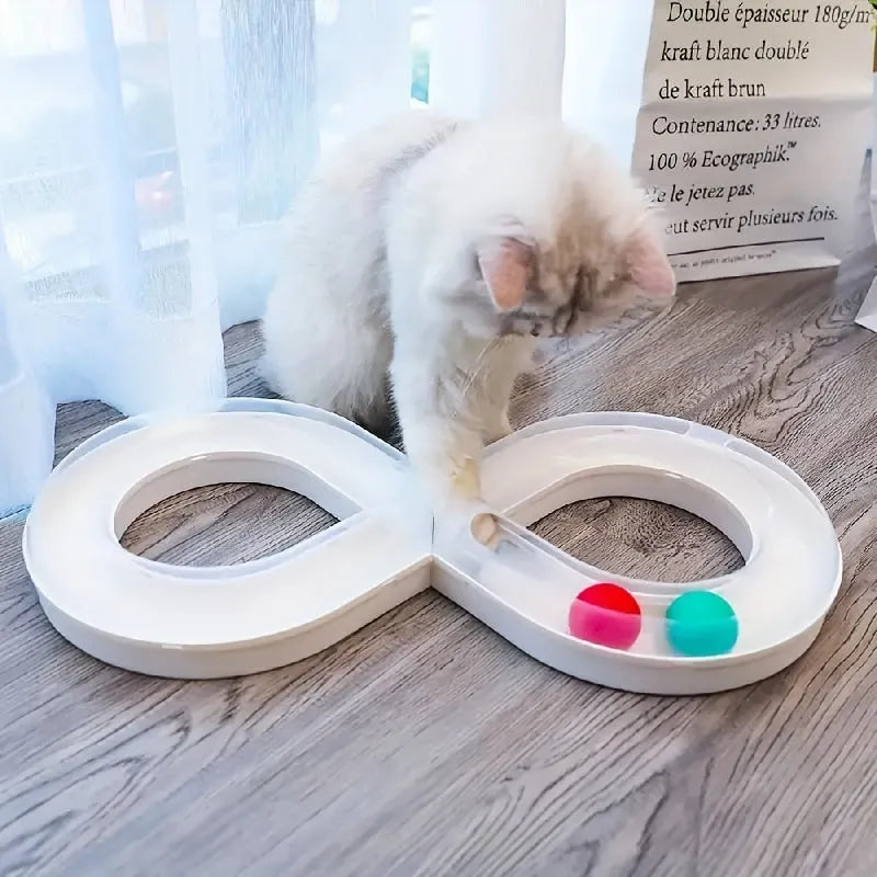 Blue and white interactive cat play station with turntable track, ball, and feather teaser stick.