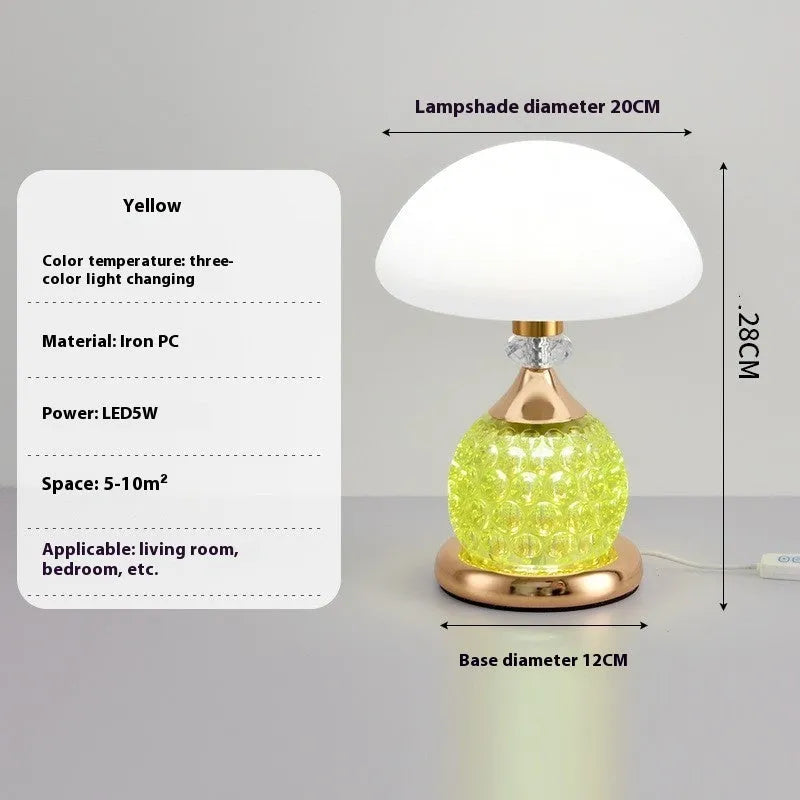 Light luxury mushroom table lamp with carved base in transparent colour on a wooden bedside table