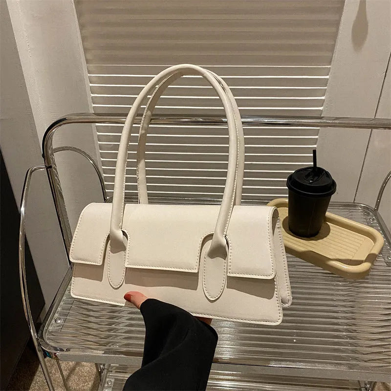 Women's horizontal square shoulder bag in PU leather with decorative stitching and single strap