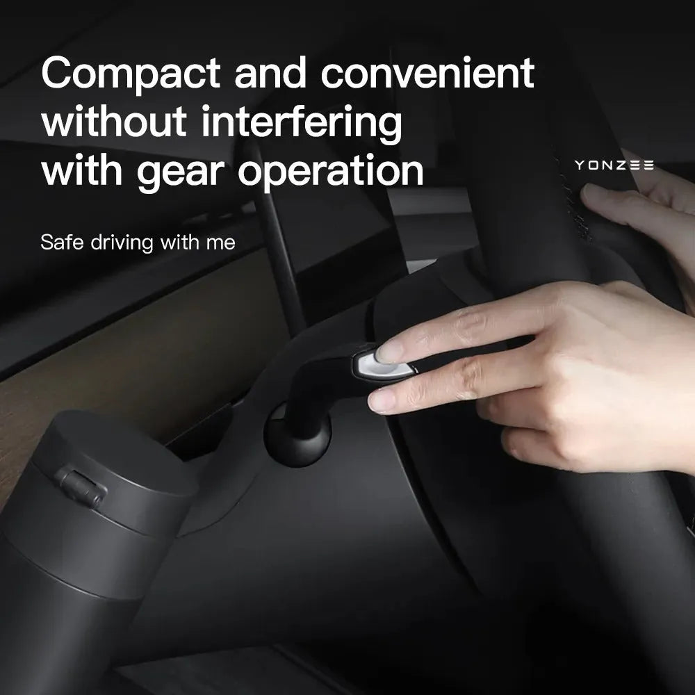 Plastic waterproof cup holder for Tesla Model 3 and Model Y dashboard, shown with a handle.
