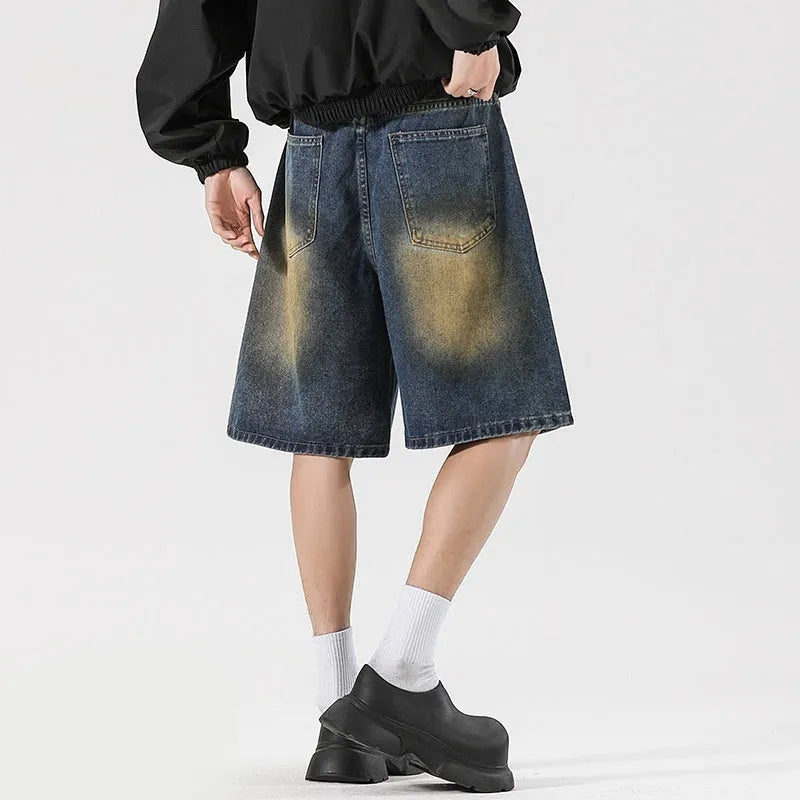 Men's loose-fit ripped jeans in retro blue cotton denim with streetwear styling