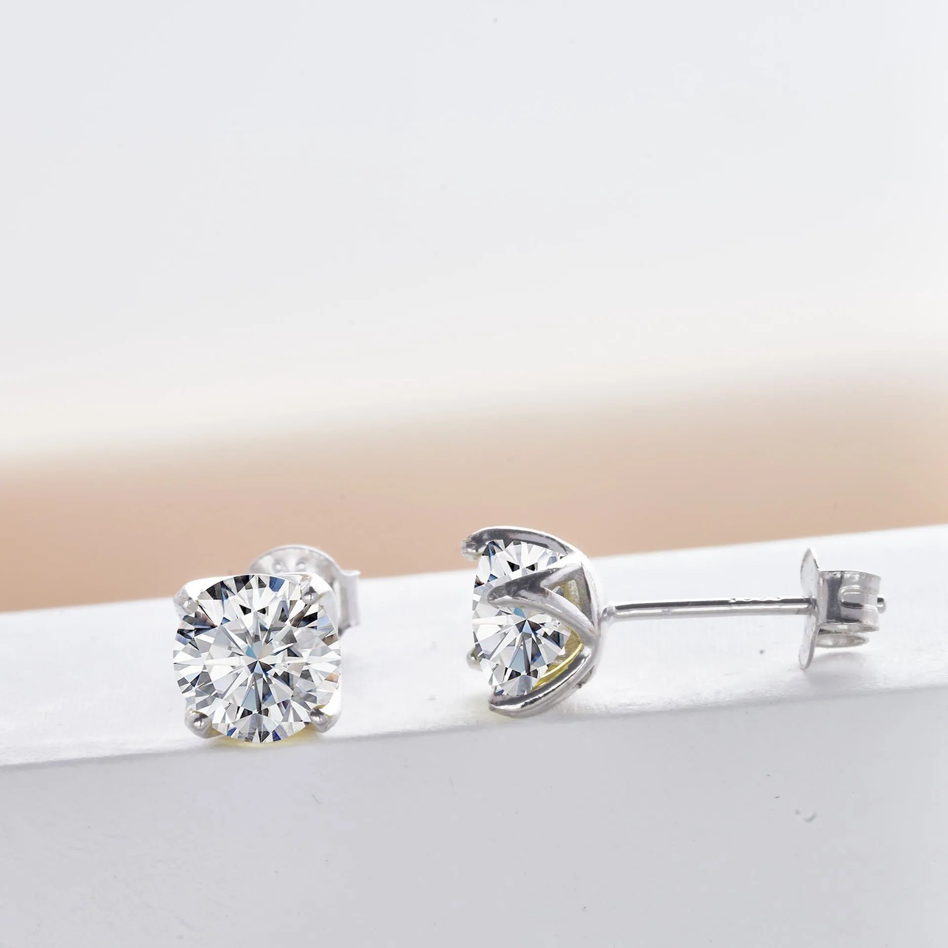 Micro inlaid moissanite stud earrings in S925 sterling silver with round natural stones, unisex design, 1CT per pair