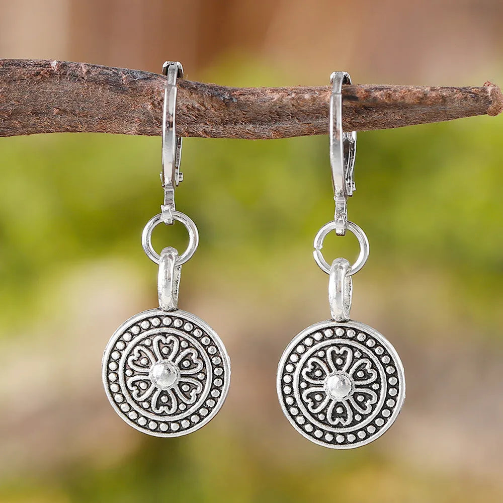Geometric round women's earrings with distressed ethnic print in retro bohemian style.