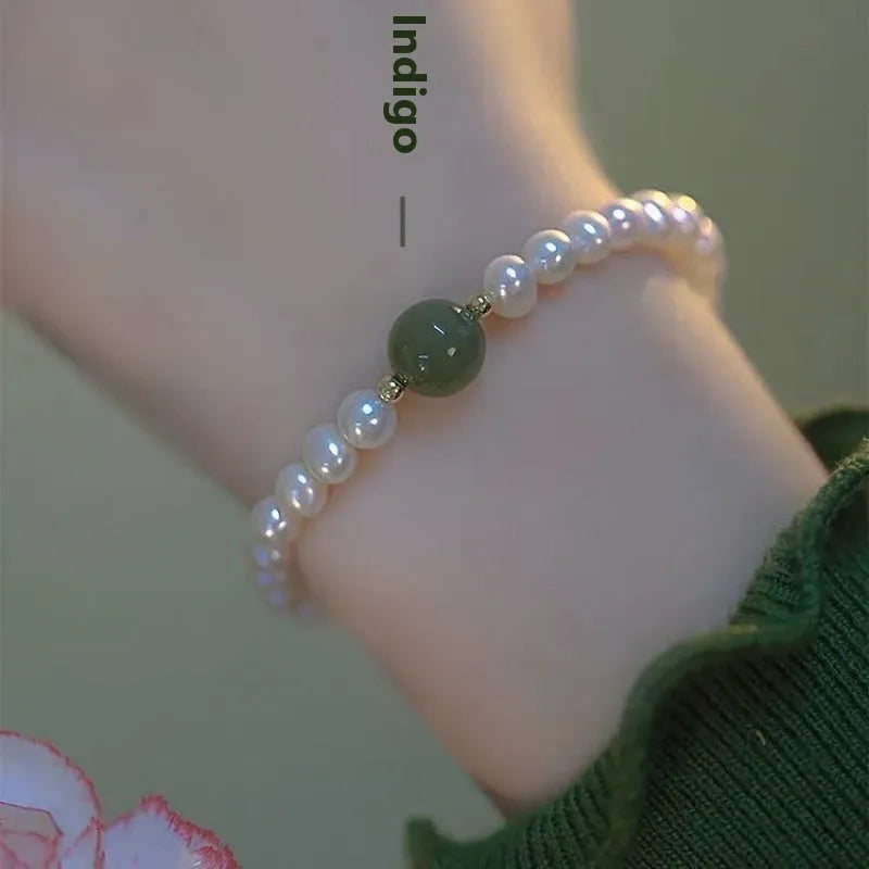 Chinese style glass bracelet with bamboo joint details in a red Lvzhu Duobao design.