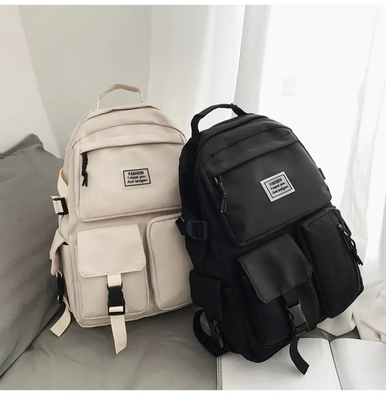 Black nylon student backpack showing laptop compartment and three-dimensional pockets
