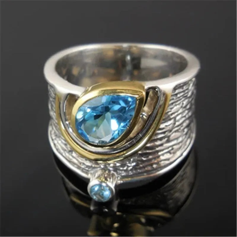 Blue zircon Chinese style women's ring with drop shape design and alloy construction