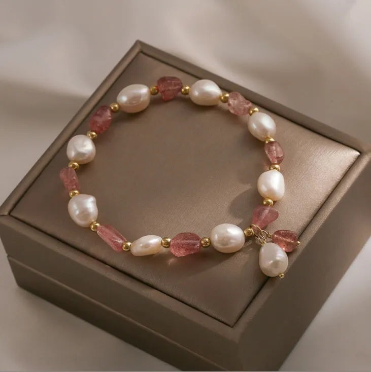 Handcrafted strawberry quartz crystal bracelet with Hetian jade peach blossom charms for women