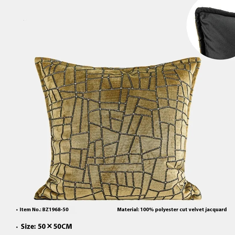 Gold geometric abstract pattern on a square polyester cushion cover with tassel detail.