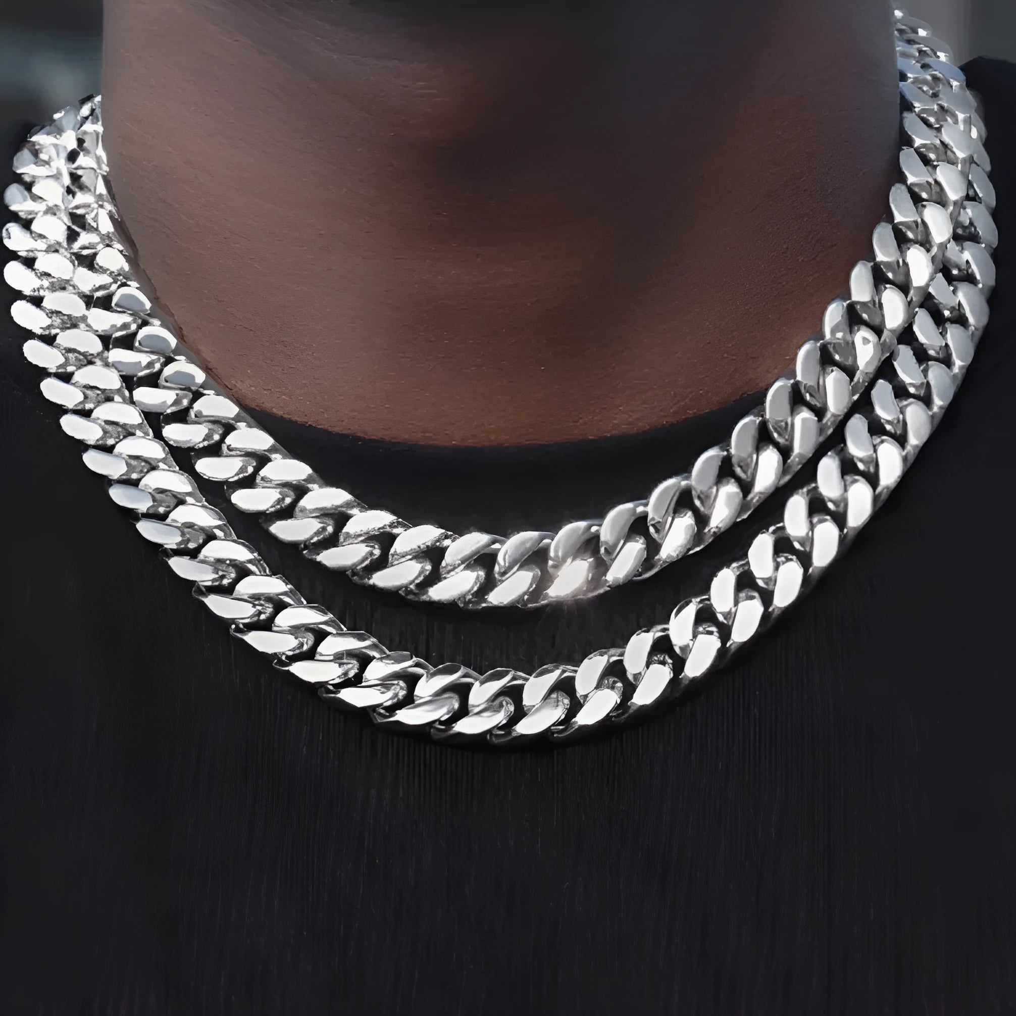 Polished titanium steel Cuban link choker chain necklace in 12mm width on black background