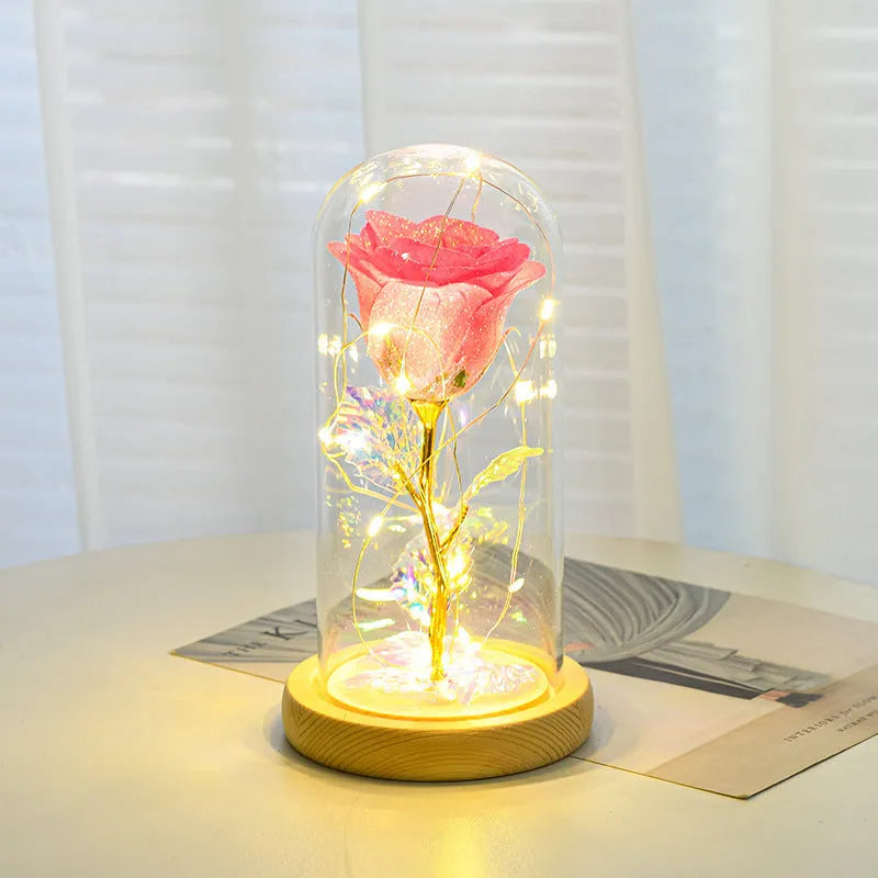 Eternal rose flower LED light in glass cover with warm white glow, six colours available, handmade
