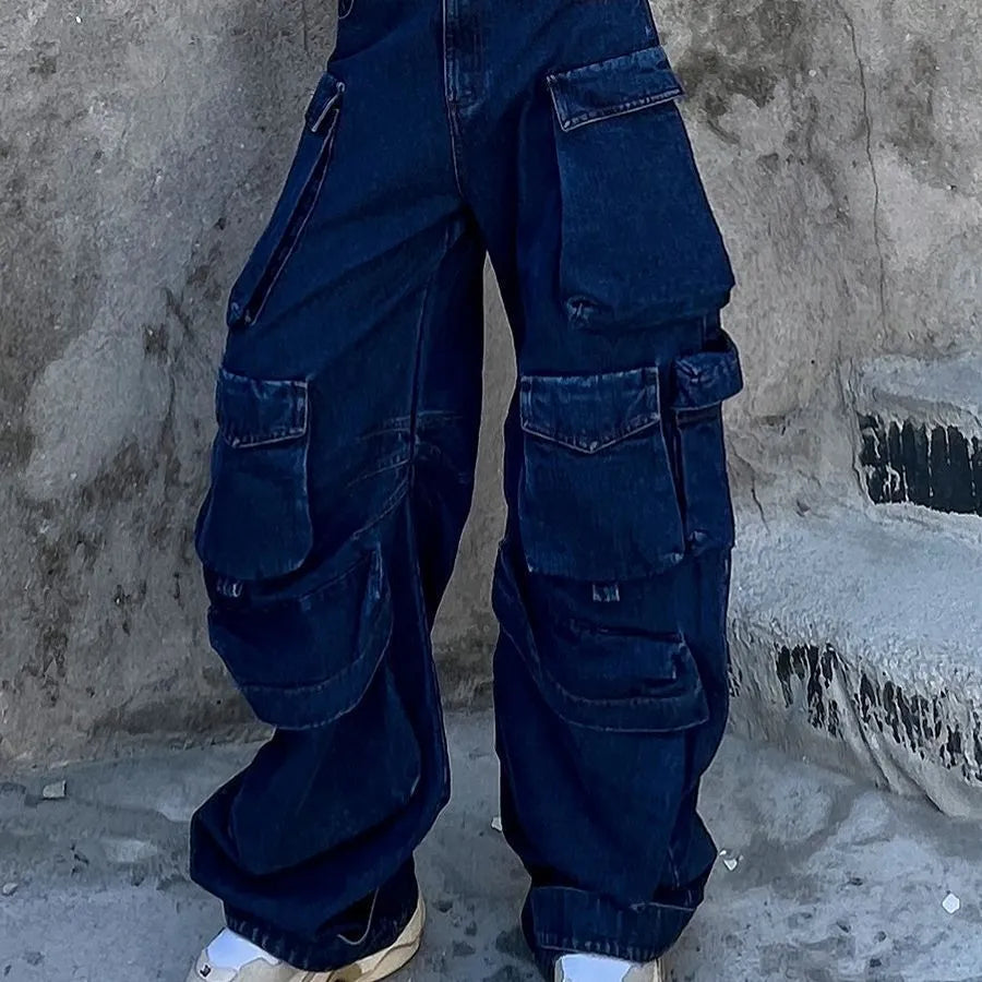 Dark blue distressed women's jeans with a high waist, wide legs, and multiple pockets on a mannequin.