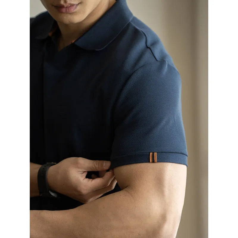 Blue American-style short-sleeved cotton blend polo shirt laid flat, showing regular fit and button placket.