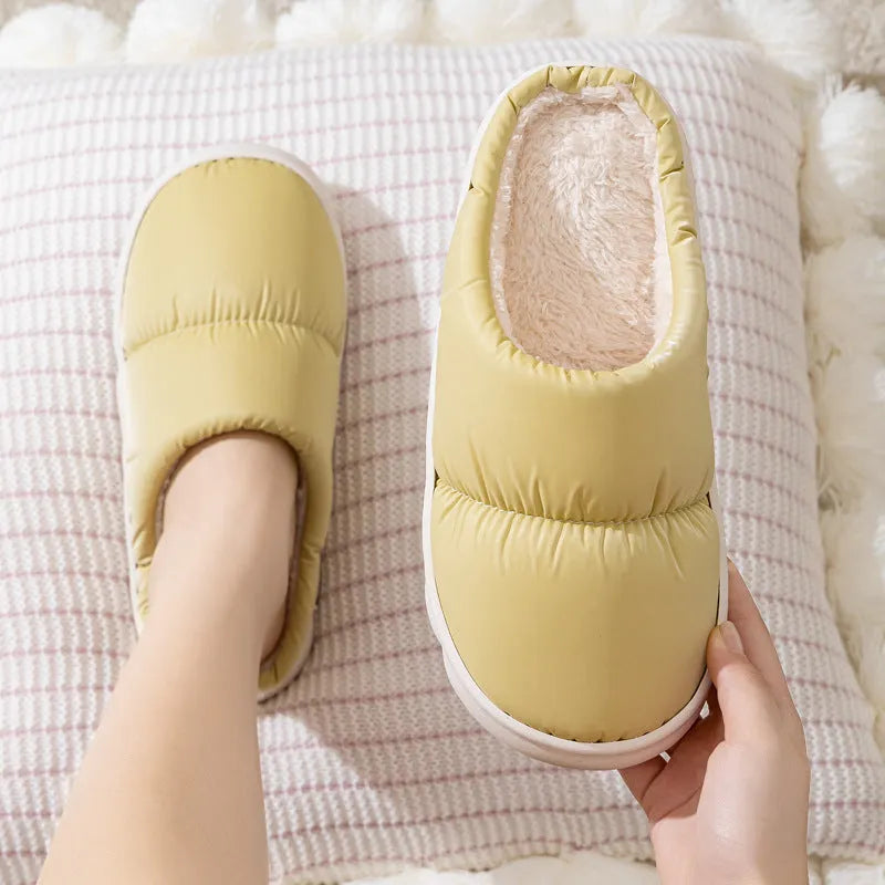 Down cotton winter slippers with artificial leather upper, thick rubber sole, and plush lining in blue colour