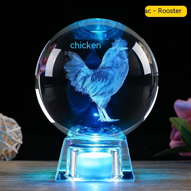White crystal zodiac decorative ball with electronic base lighting showing Chinese-style animal design