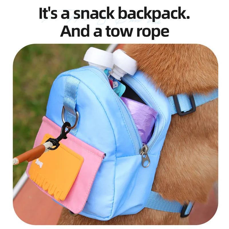 Blue adjustable dog backpack harness with storage compartment and a tow rope laid flat