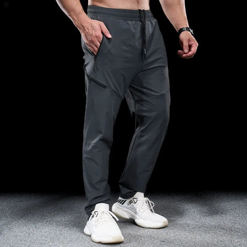 Men's waterproof workout pants in quick-drying nylon fabric for sports and fitness activities