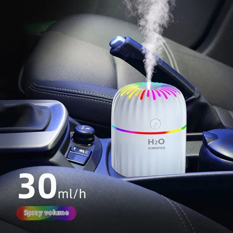 Compact green animal-shaped USB humidifier and aromatherapy diffuser on a desktop