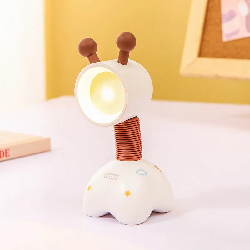 Cartoon animal magnetic night lamp with adjustable head on metallic surface