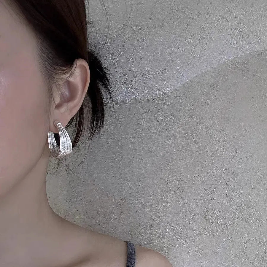 Simple geometric earrings and ear clips in silver and gold colour options
