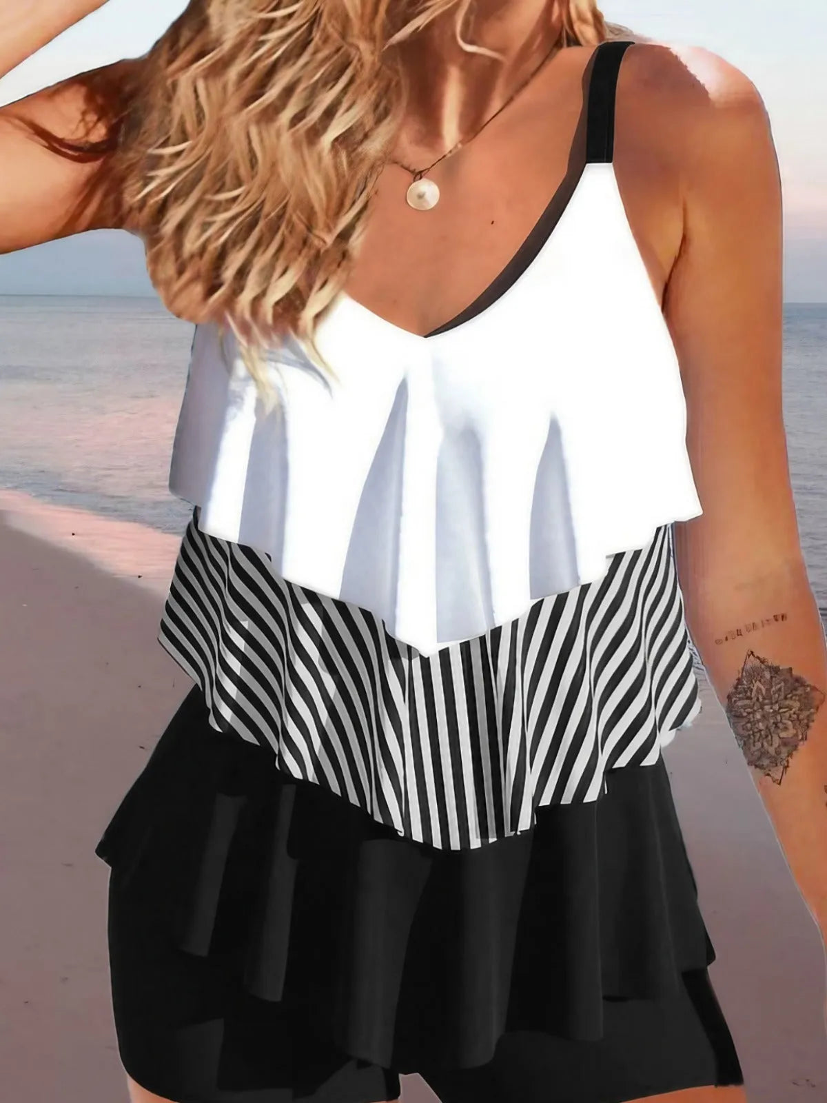 Women's backless spaghetti-strap bikini swimsuit with ruffle detail in a floral print.