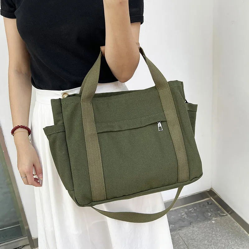 Large capacity canvas tote bag with internal organisers and side zippers in Army Green colour