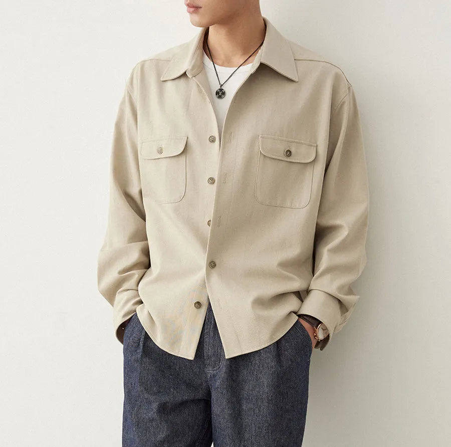 Men's long sleeve lapel shirt in light sand rice colour, showing collar detail and stitching.