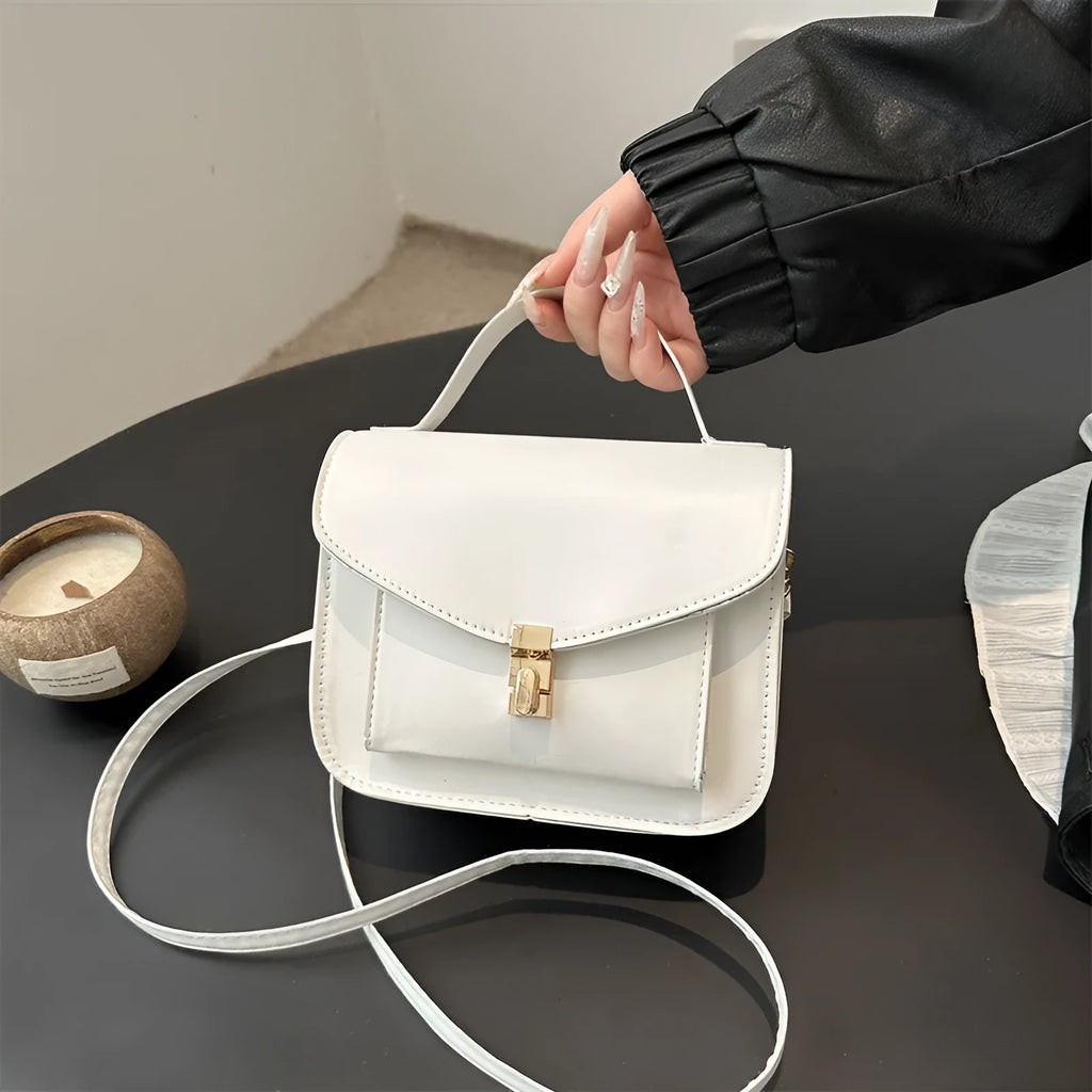 Retro style shoulder messenger bag in horizontal square shape with crossbody strap