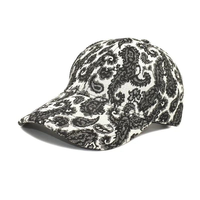Polyester baseball cap with paisley pattern print in black colour showing dome crown design