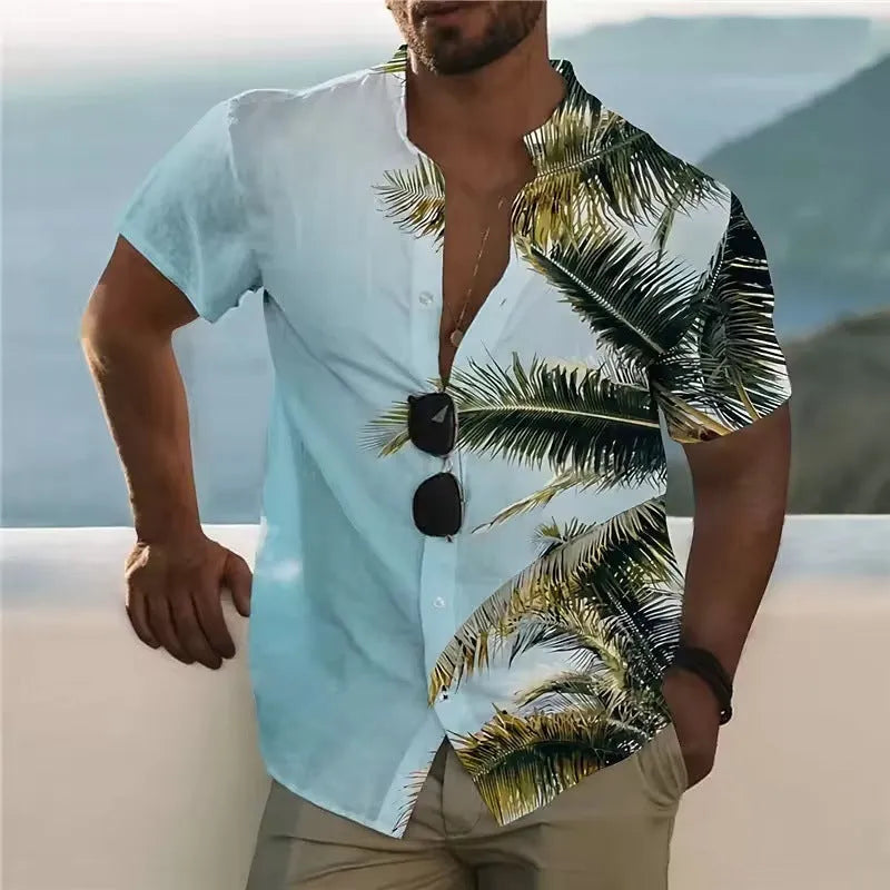 Man wearing a loose-fit short sleeve shirt with a colourful digital flower print pattern.