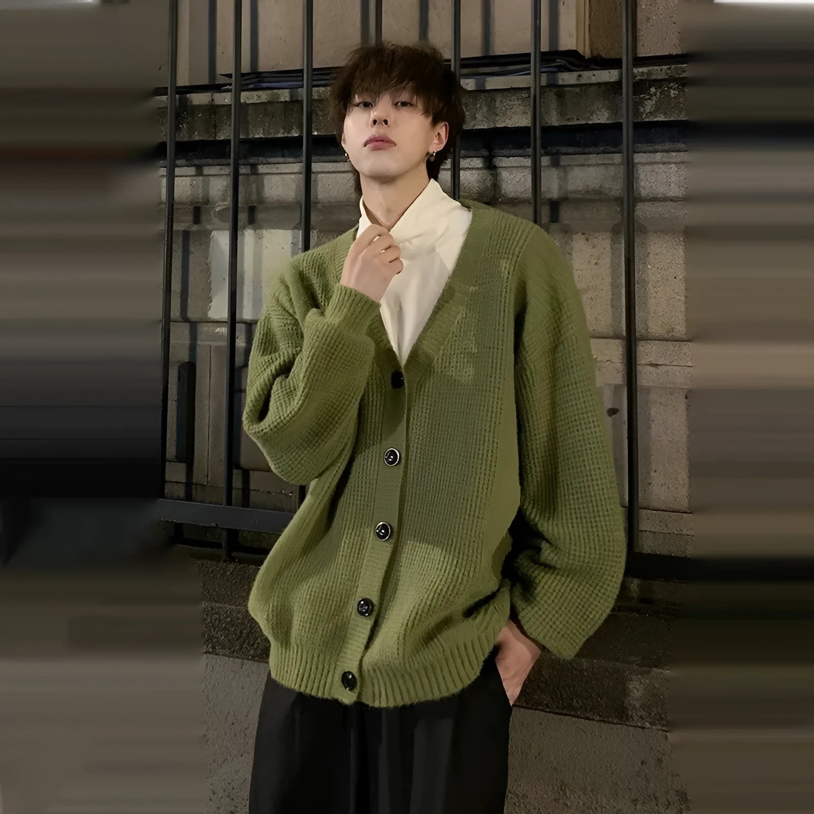Men's loose-fit V-neck cotton-blend cardigan in army green, shown on a hanger.