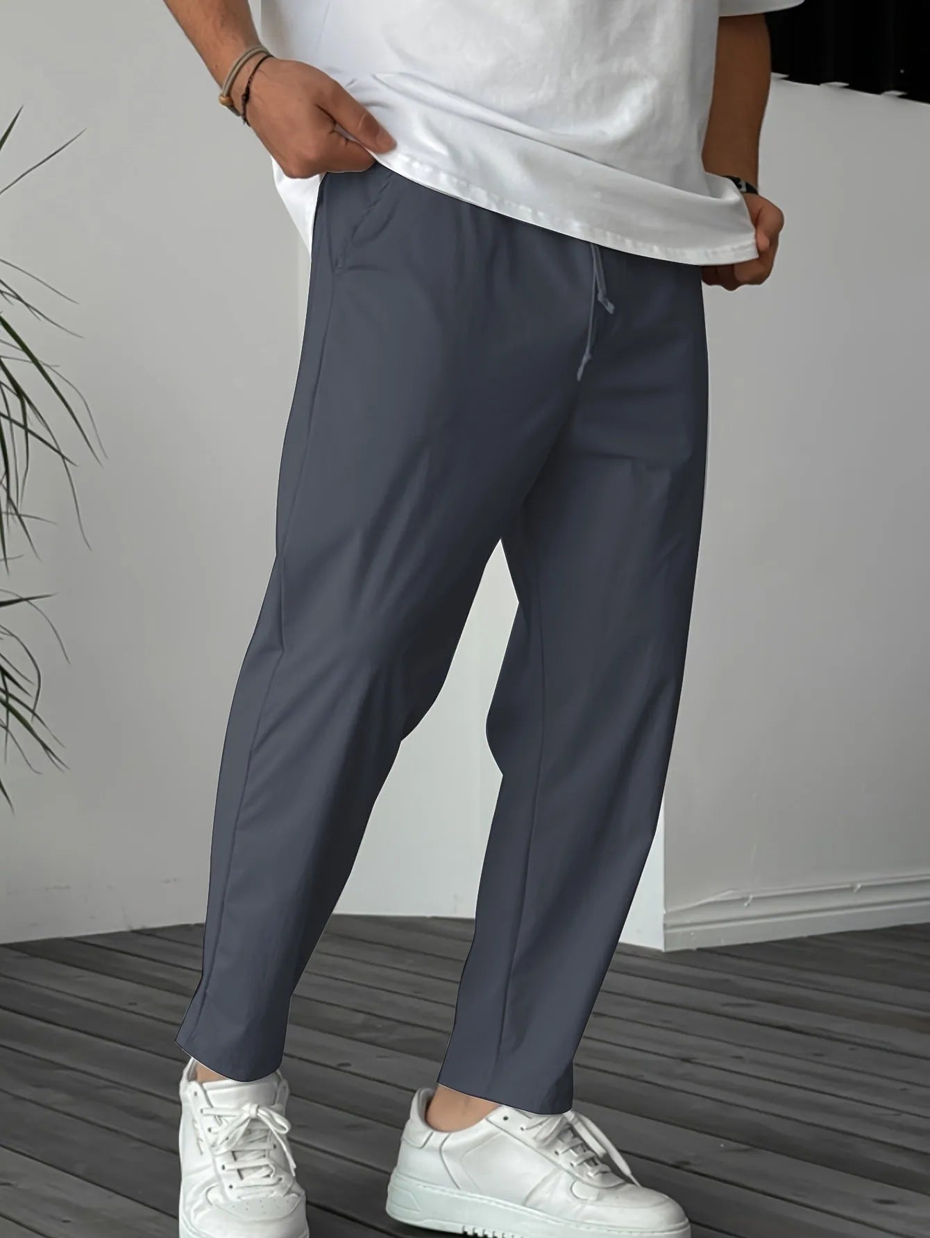 Men's khaki straight-leg casual trousers with a drawstring waist and ribbon pocket.