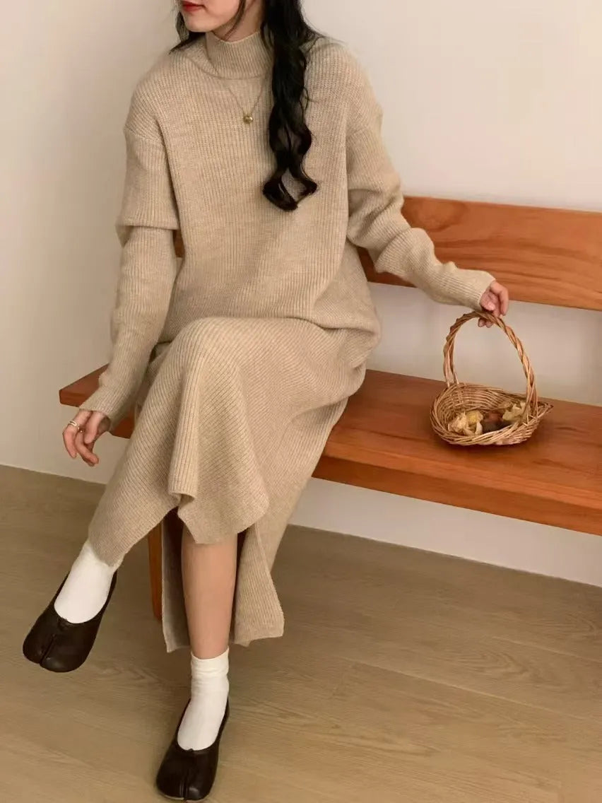 Women's knitted half turtleneck dress in acrylic with long sleeves and a high-waisted midi skirt.