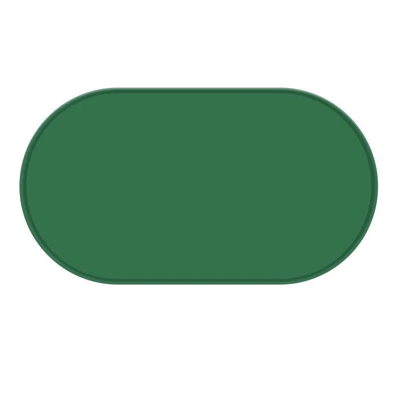 Green silicone waterproof cat feeding placemat with non-slip backing under a food bowl