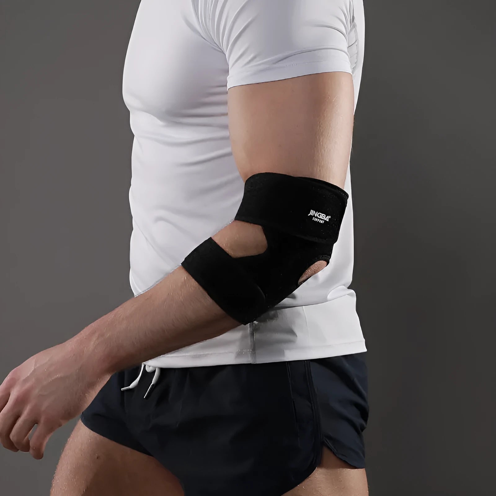 Black adjustable sports elbow guard for badminton, basketball, tennis, and fitness training.