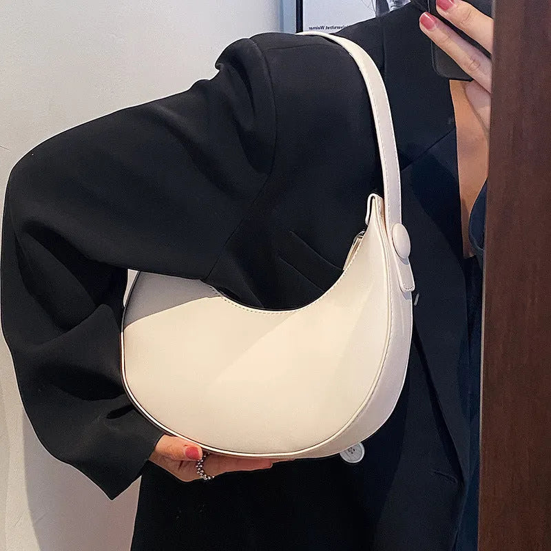 Women's retro-style PU shoulder bag in a dumpling shape, shown in one of four colours: black, cream yellow, brown, or white.