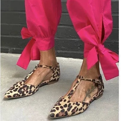 Leopard print women's pumps with pointed toe, chunky low heel, and ankle strap in PU material