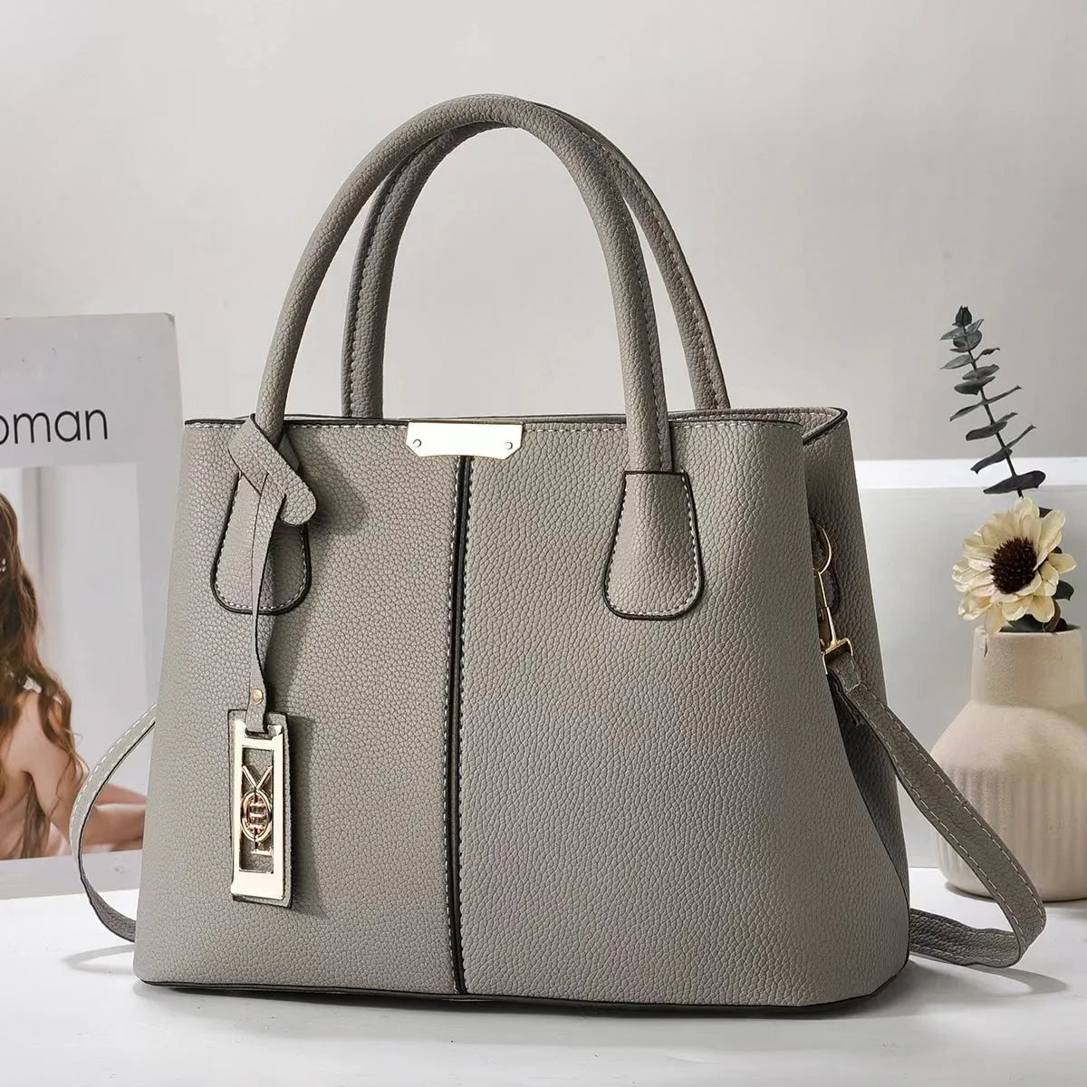 Soft PU fashion handbag with leather shoulder strap in horizontal square shape